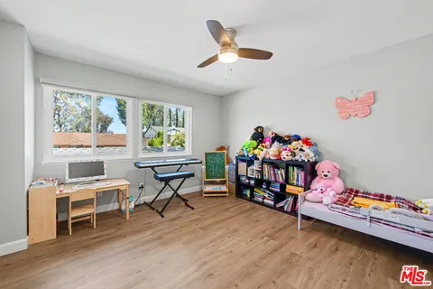 a bedroom with a bed furniture and a window