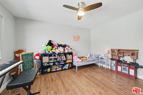 a bedroom with a bed and a mirror