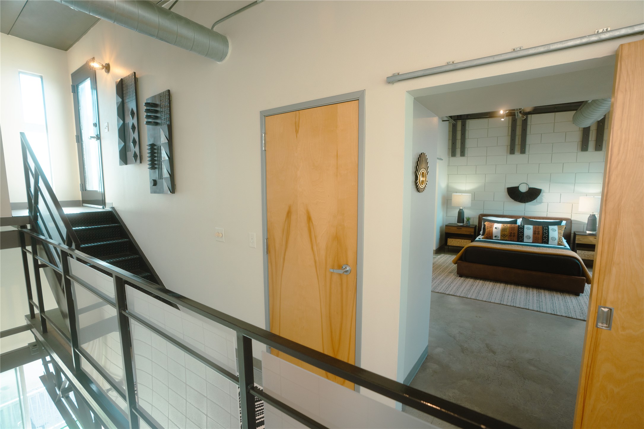 4801 South Congress Avenue, Unit H5 Austin, TX 78745 - Photo 25 of 39 Staircase featuring finished concrete floors