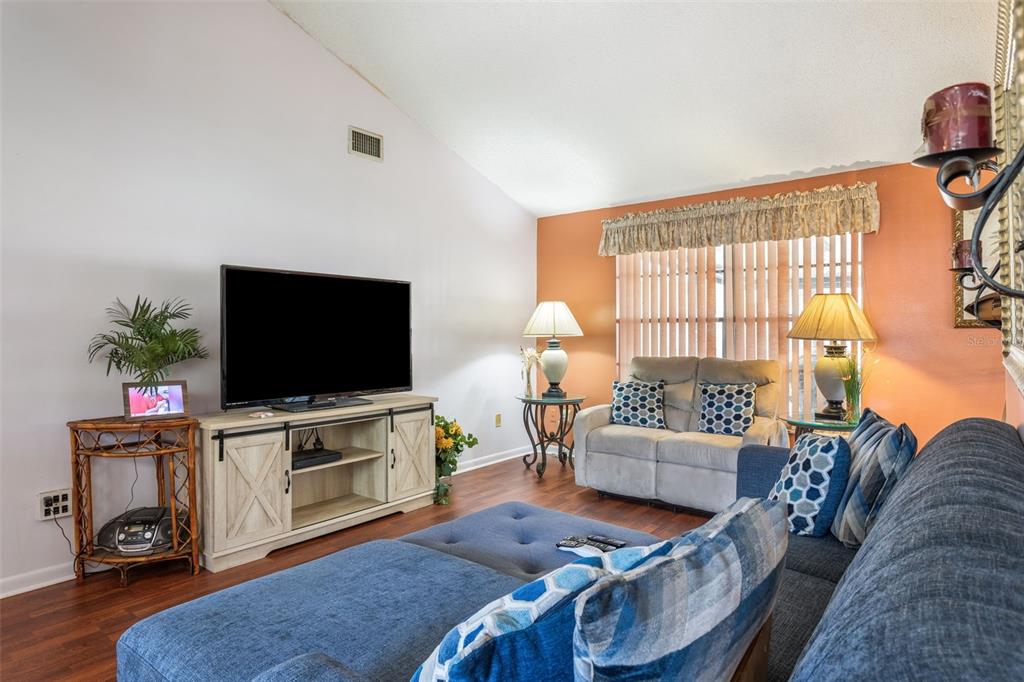 502 Avocado Circle Brandon, FL 33510 - Photo 11 of 50 a living room with furniture and a flat screen tv