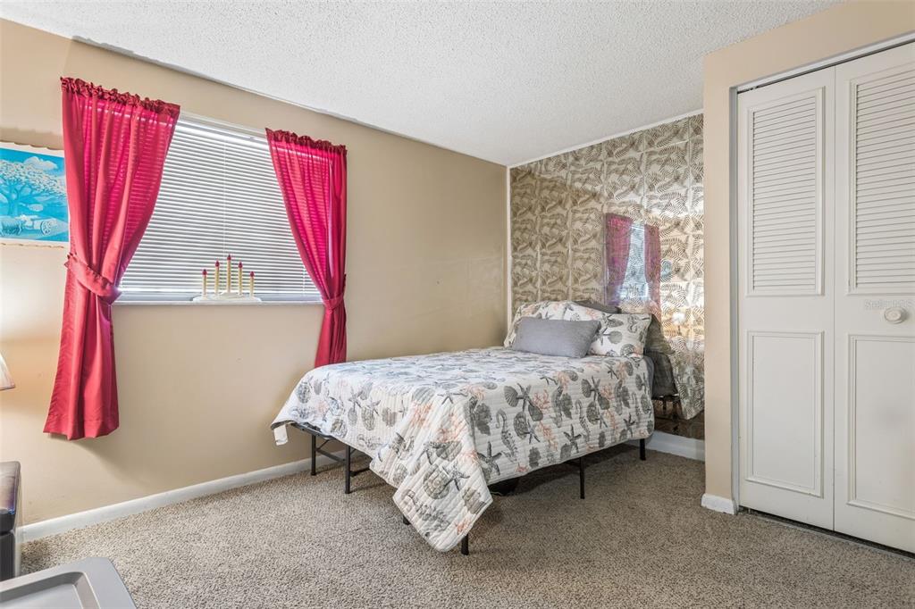 502 Avocado Circle Brandon, FL 33510 - Photo 23 of 50 a bedroom with a bed and a window