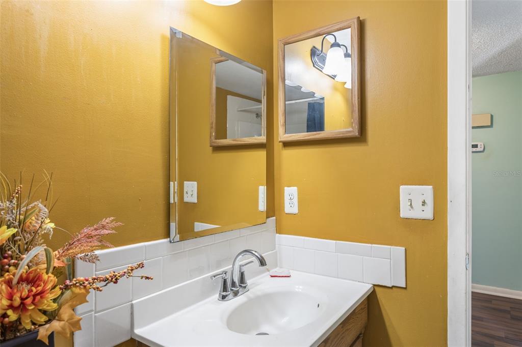 502 Avocado Circle Brandon, FL 33510 - Photo 26 of 50 a bathroom with a sink and a mirror
