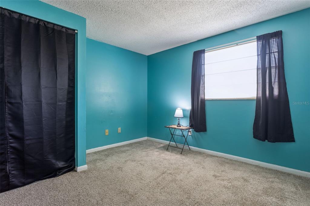 502 Avocado Circle Brandon, FL 33510 - Photo 27 of 50 a view of a room with a window and a ceiling fan
