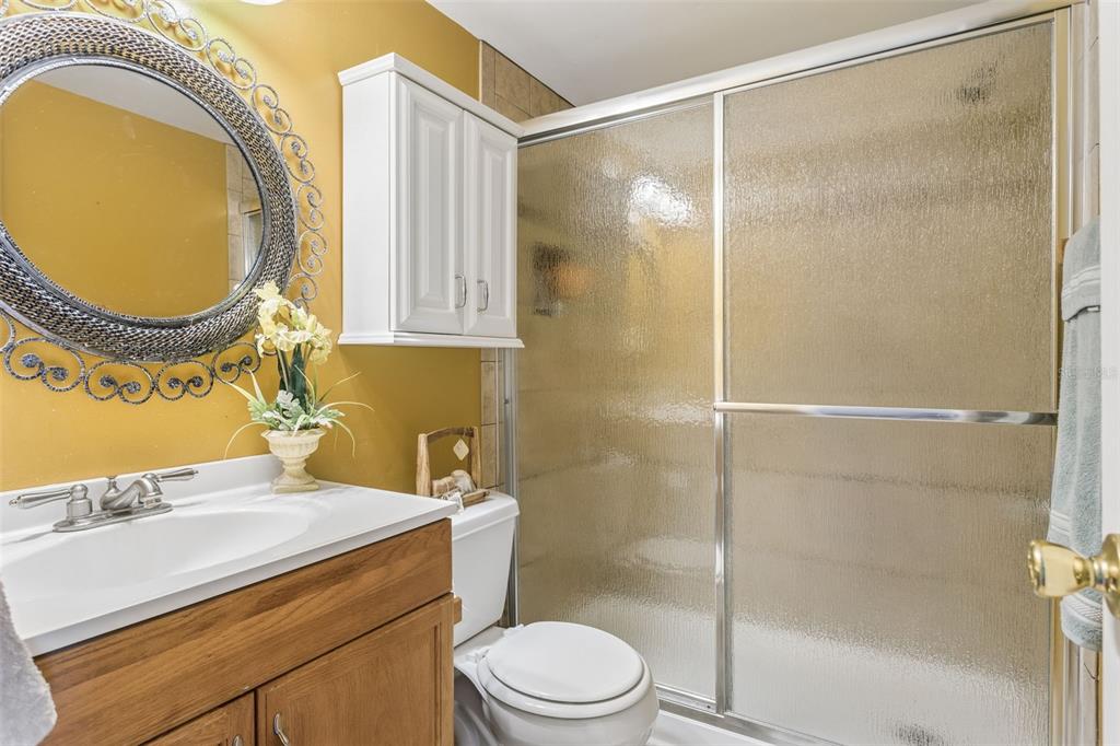 502 Avocado Circle Brandon, FL 33510 - Photo 32 of 50 a bathroom with a sink mirror vanity and toilet