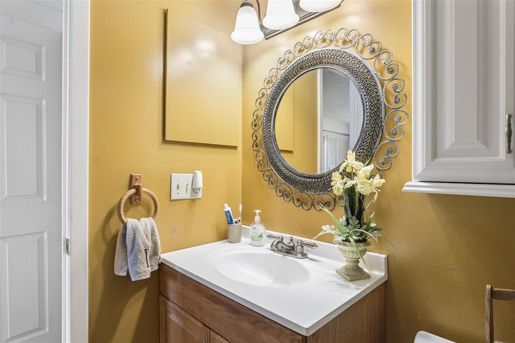 502 Avocado Circle Brandon, FL 33510 - Photo 33 of 50 a bathroom with a sink mirror and vanity