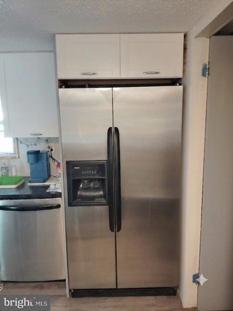 13025 Thunder Road King George, VA 22485 - Photo 33 of 34 Sleek stainless steel refrigerator.