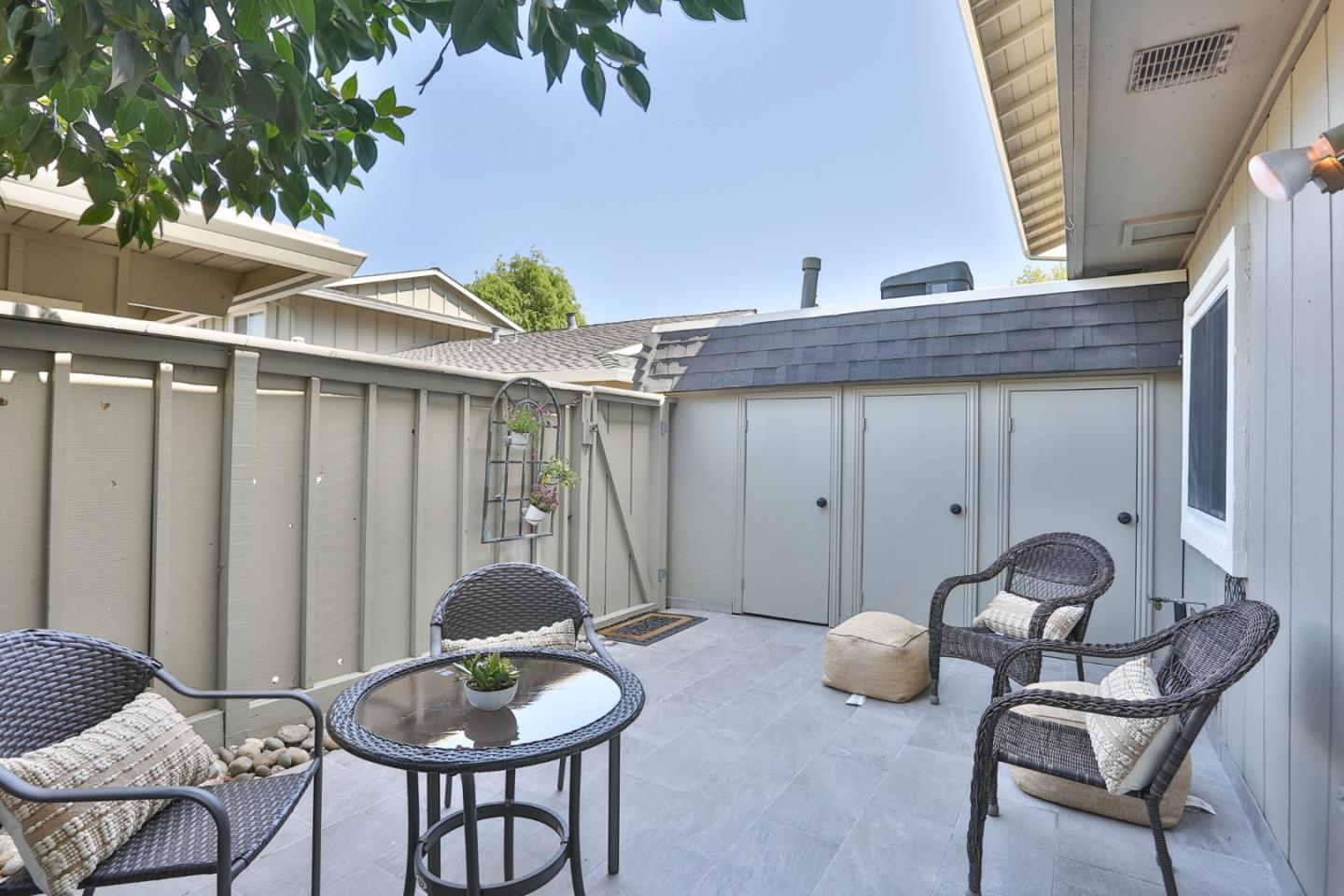 2840 Bollinger Canyon Road San Ramon, CA 94583 - Photo 21 of 23 a backyard of a house with table and chairs