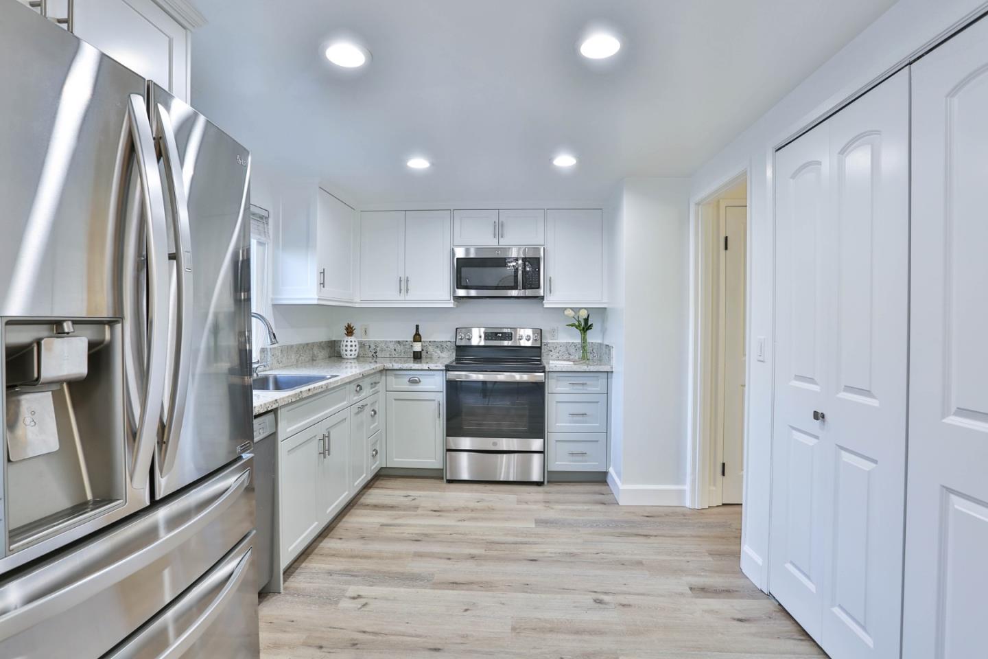 2840 Bollinger Canyon Road San Ramon, CA 94583 - Photo 5 of 23 a kitchen with stainless steel appliances a refrigerator sink and stove