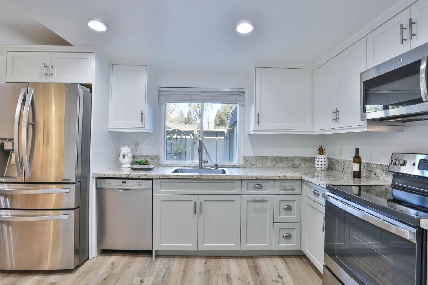 2840 Bollinger Canyon Road San Ramon, CA 94583 - Photo 6 of 23 a kitchen with stainless steel appliances granite countertop a stove a sink and a refrigerator