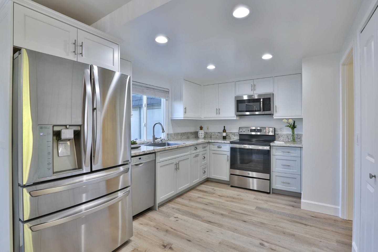 2840 Bollinger Canyon Road San Ramon, CA 94583 - Photo 7 of 23 a kitchen with a refrigerator stove and sink