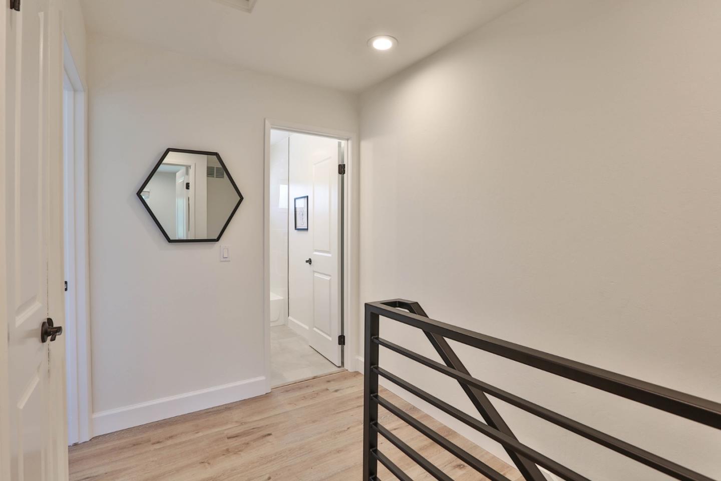 2840 Bollinger Canyon Road San Ramon, CA 94583 - Photo 9 of 23 a view of a hallway with wooden floor