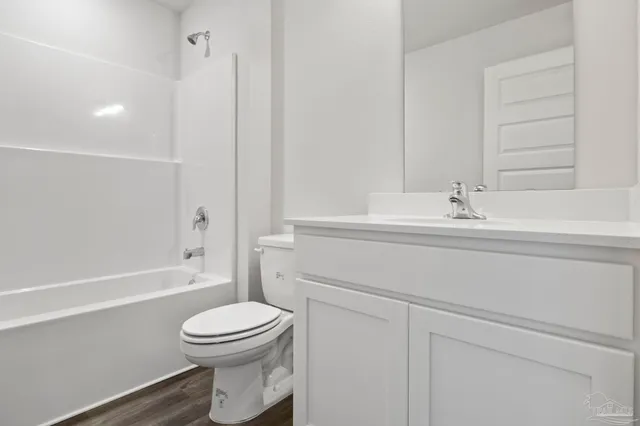 a bathroom with a sink and vanity