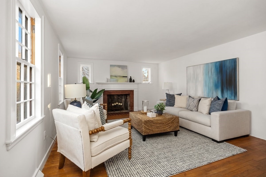 12 Hoover Road Hingham, MA 02043 - Photo 13 of 32 a living room with furniture and a fireplace