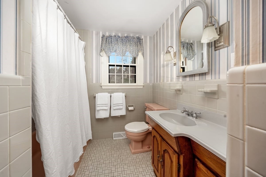 12 Hoover Road Hingham, MA 02043 - Photo 15 of 32 a bathroom with a sink a toilet and a mirror