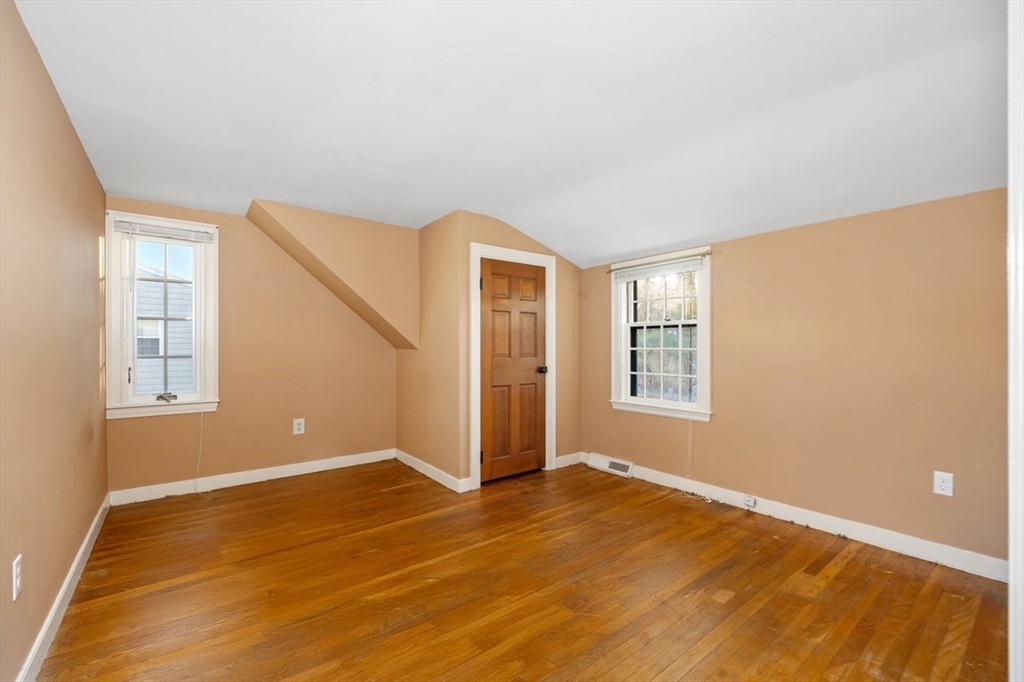 12 Hoover Road Hingham, MA 02043 - Photo 21 of 32 a view of an empty room with wooden floor and a window