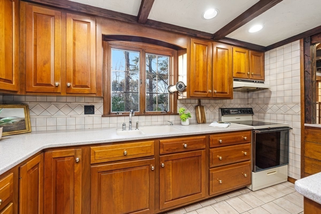 12 Hoover Road Hingham, MA 02043 - Photo 8 of 32 a kitchen with stainless steel appliances granite countertop wooden cabinets a sink and a large window