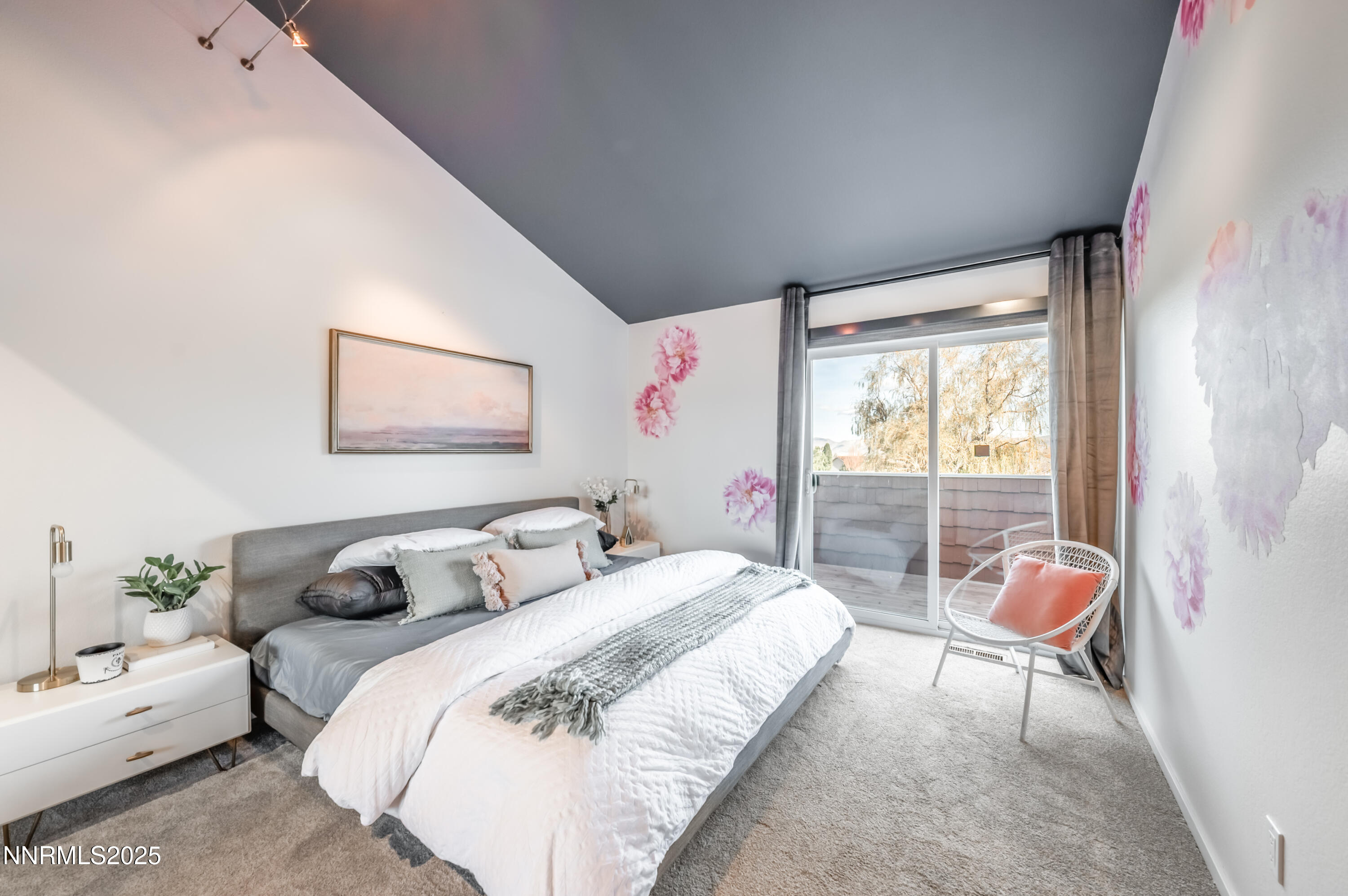 40 MacFarlane Drive Reno, NV 89511 - Photo 21 of 37 a bedroom with a bed and glass window