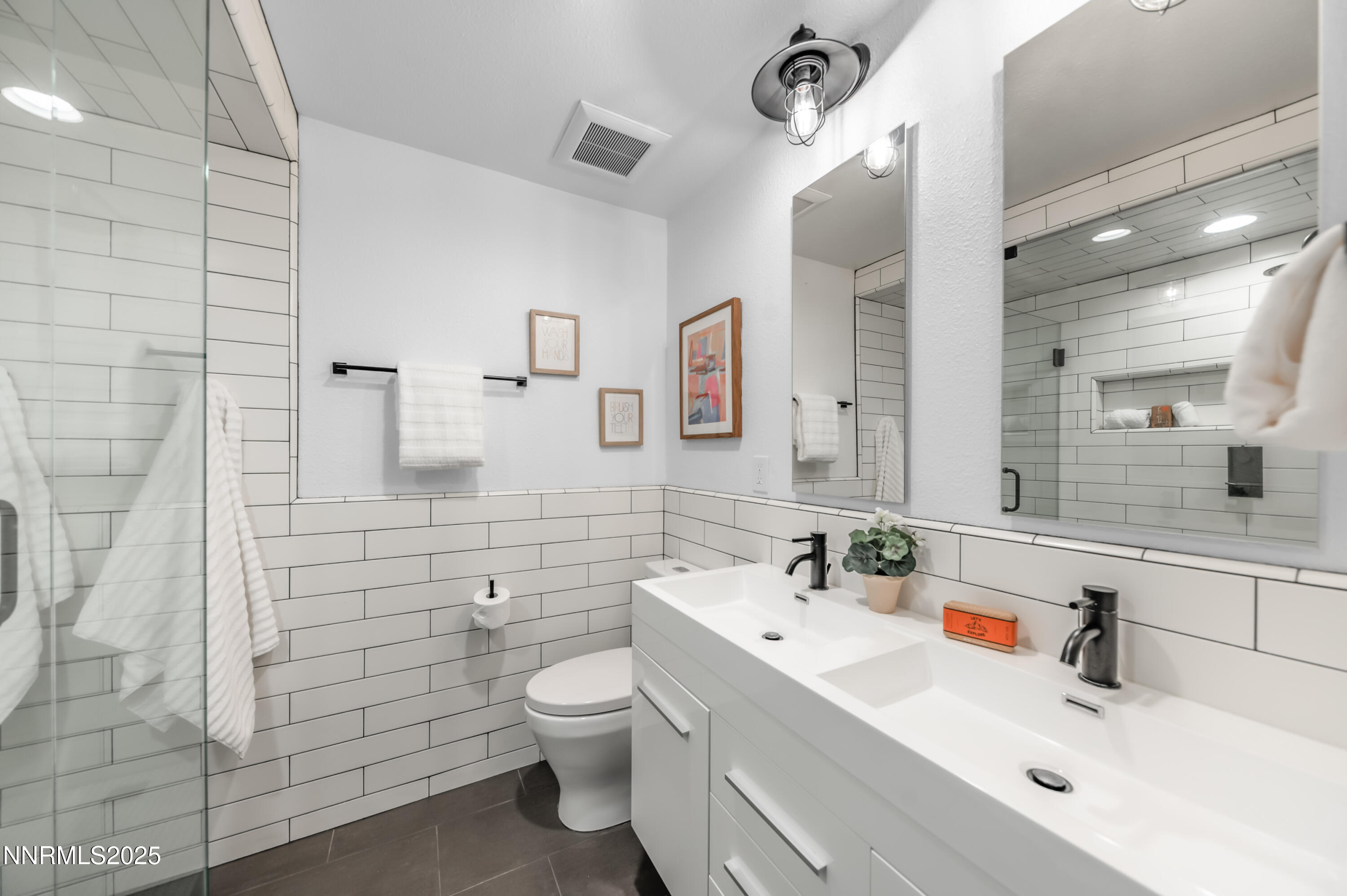 40 MacFarlane Drive Reno, NV 89511 - Photo 22 of 37 a bathroom with a sink a toilet and shower