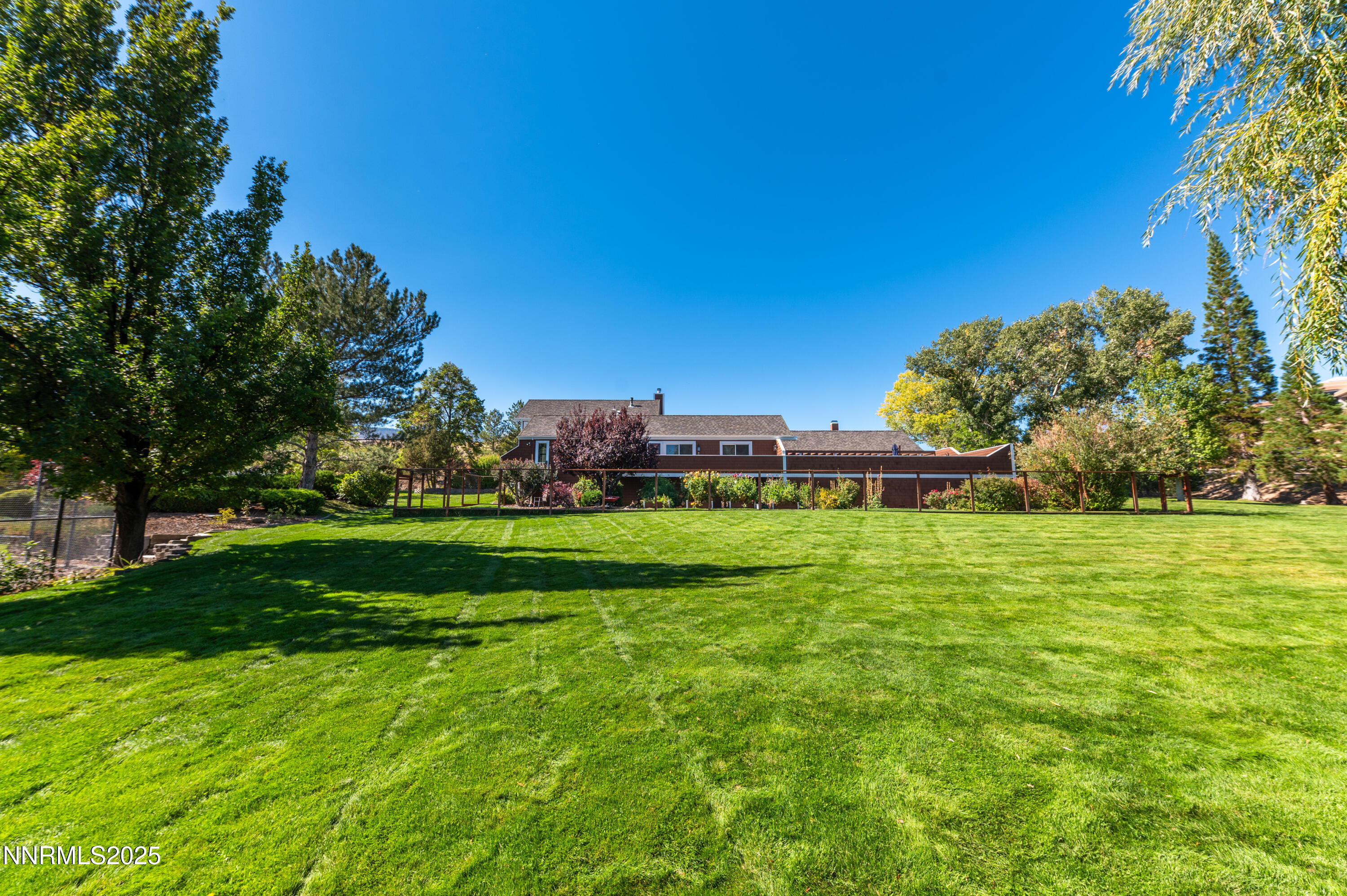 40 MacFarlane Drive Reno, NV 89511 - Photo 26 of 37 a view of house with garden and trees