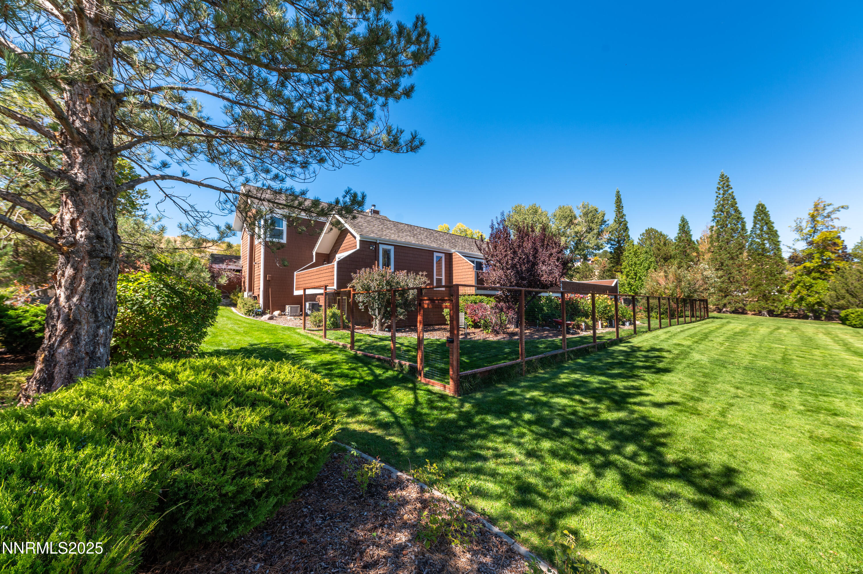 40 MacFarlane Drive Reno, NV 89511 - Photo 27 of 37 a view of a garden with a building in the background