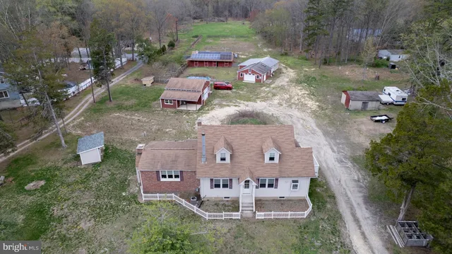 an aerial view of a house with outdoor space
