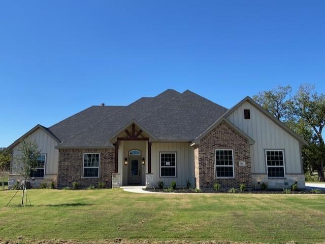 1004 Hennesay Park Springtown, TX 76082 - Photo 1 of 20 a front view of a house with a yard