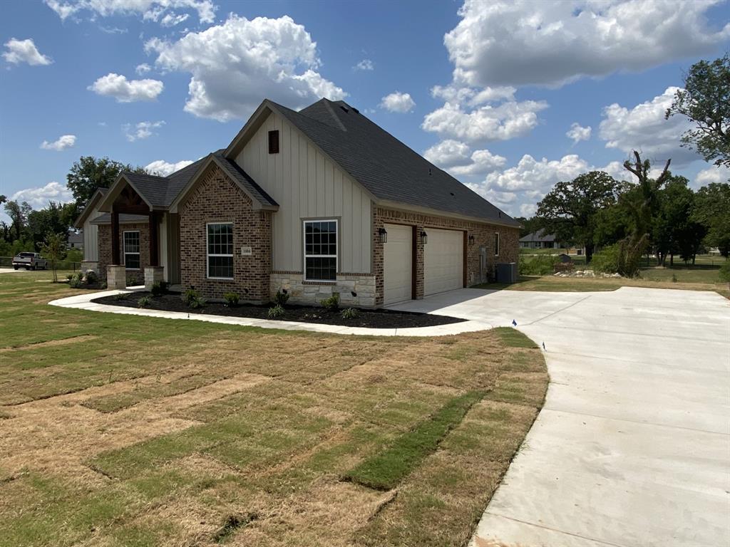 1004 Hennesay Park Springtown, TX 76082 - Photo 2 of 20 a front view of house with yard