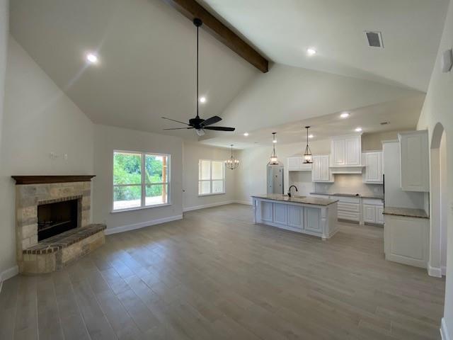 1004 Hennesay Park Springtown, TX 76082 - Photo 7 of 20 a living room with stainless steel appliances kitchen island furniture and a fireplace