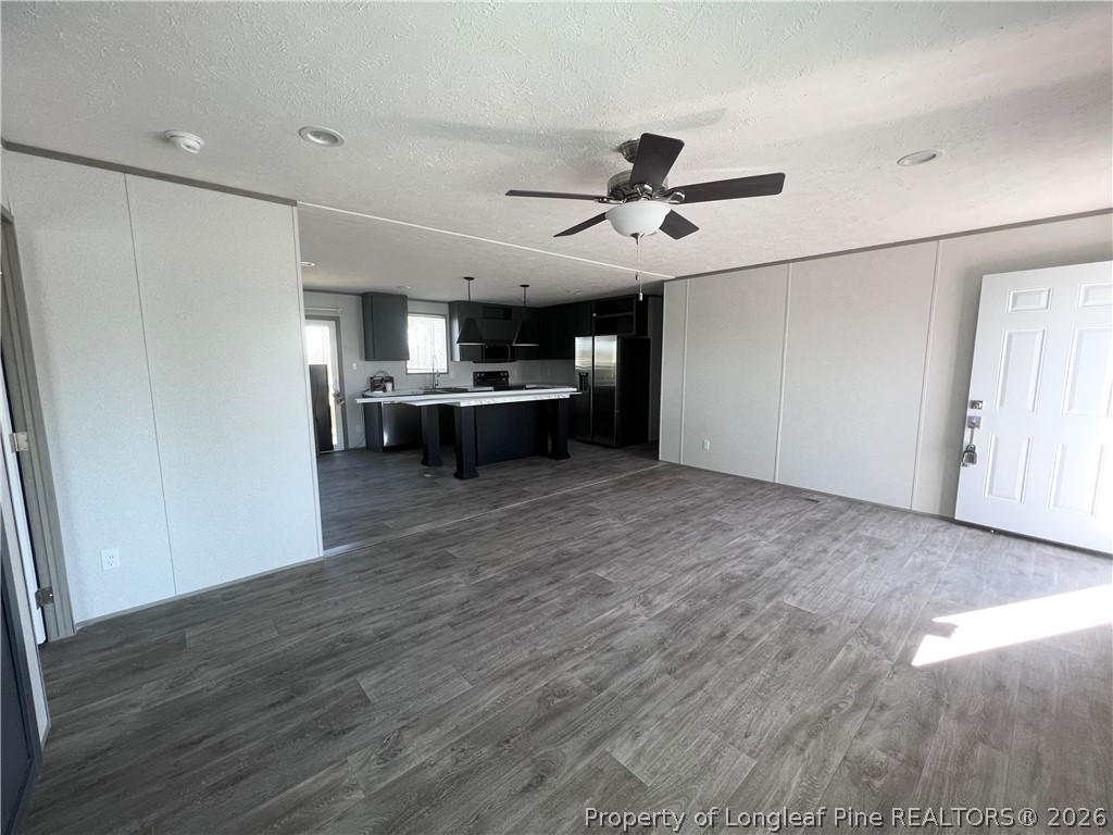 1452 Mercer Mill Road Lumberton, NC 28358 - Photo 15 of 17 a view of a kitchen with a sink and a refrigerator