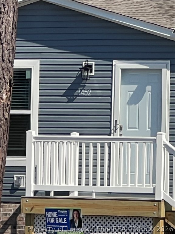 1452 Mercer Mill Road Lumberton, NC 28358 - Photo 2 of 17 a view of a house with a small deck