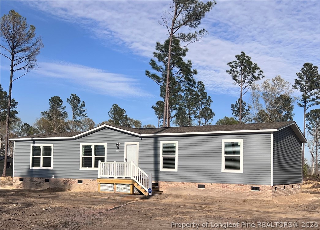 1452 Mercer Mill Road Lumberton, NC 28358 - Photo 2 of 19 a view of a house with a backyard