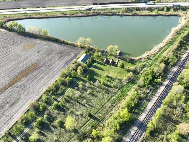a aerial view of a house with a lake view