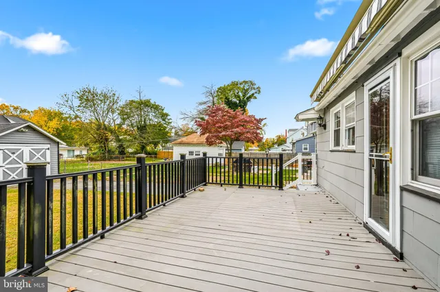 a view of a house with wooden fence