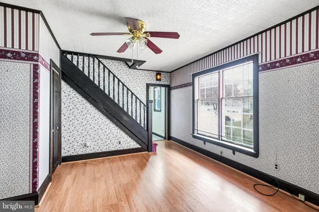 a view of an entryway with wooden floor