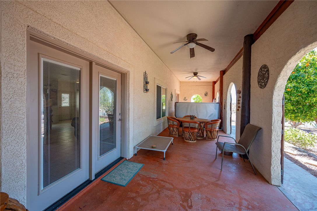 14105 Cactus Road Yucca, AZ 86438 - Photo 25 of 47 a living room with furniture and a large window