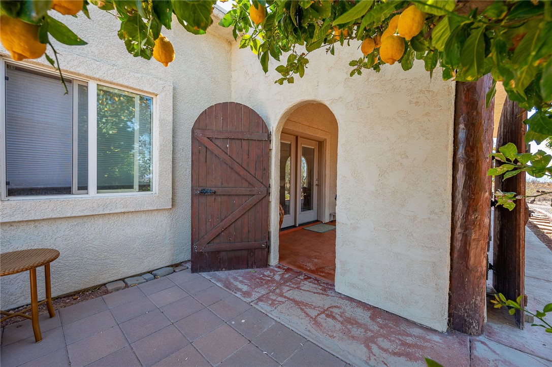 14105 Cactus Road Yucca, AZ 86438 - Photo 31 of 47 a view of entryway with a potted plant