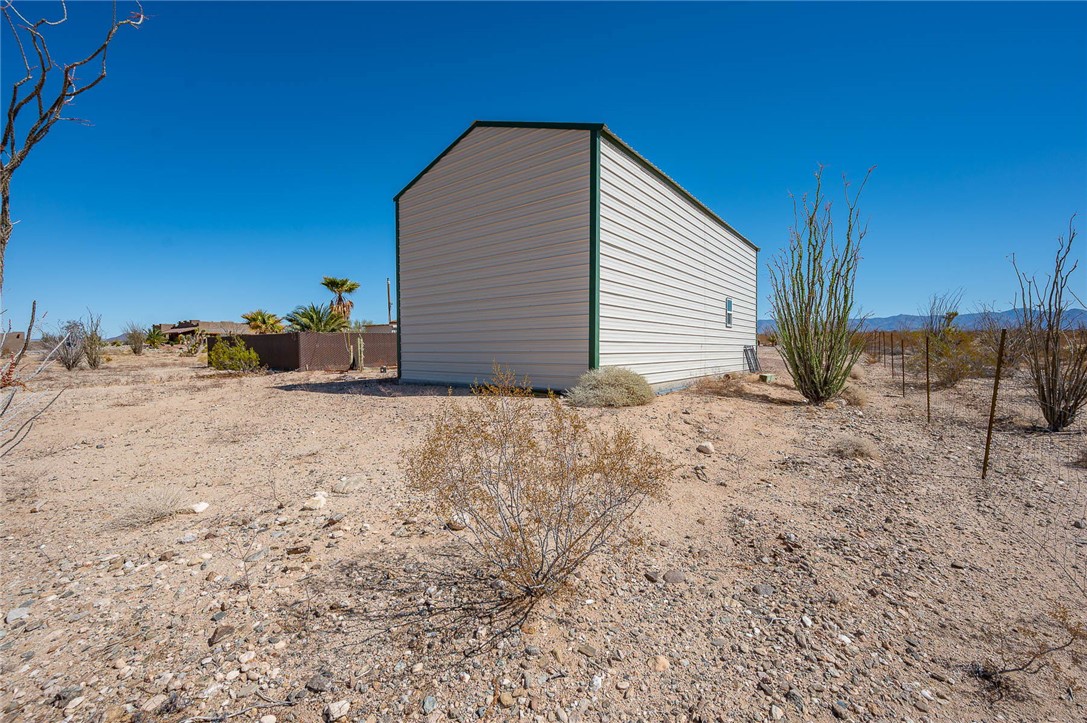 14105 Cactus Road Yucca, AZ 86438 - Photo 39 of 47 a view of storage and utility room