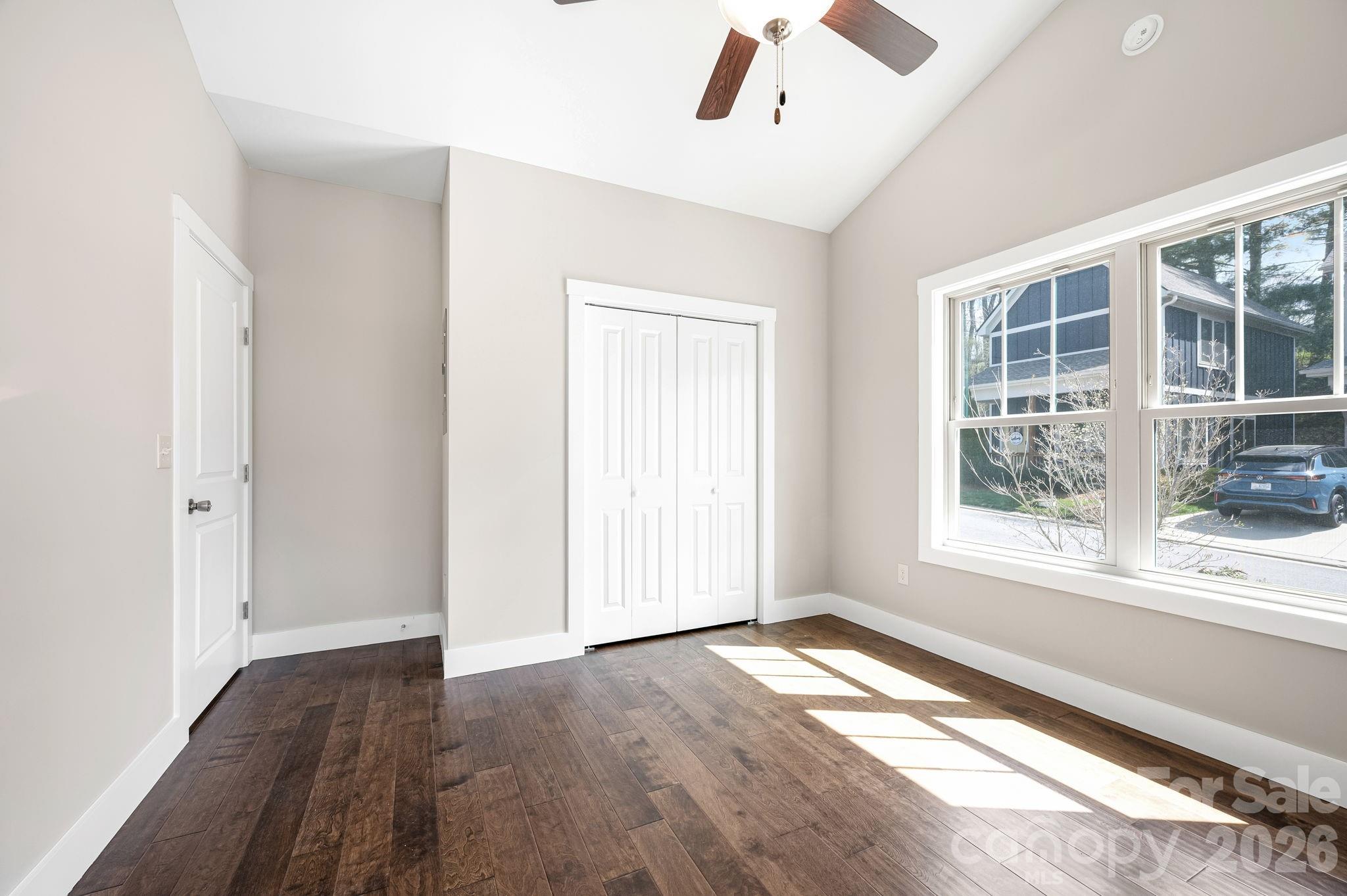 79 Wheeler Road Weaverville, NC 28787 - Photo 14 of 33 an empty room with wooden floor and windows
