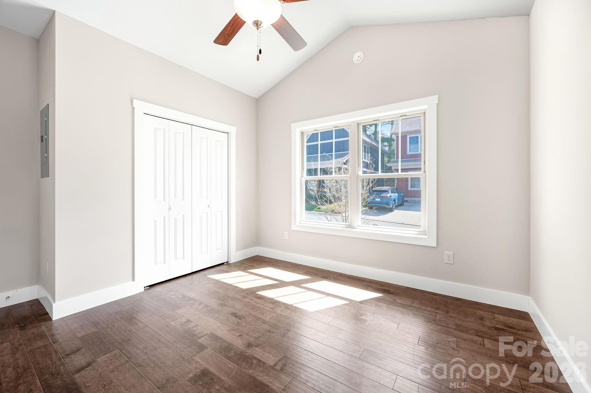 79 Wheeler Road Weaverville, NC 28787 - Photo 15 of 33 an empty room with wooden floor and windows