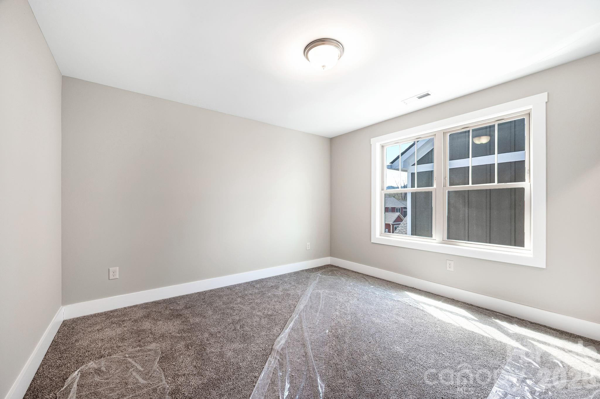 79 Wheeler Road Weaverville, NC 28787 - Photo 24 of 33 a view of empty room with windows