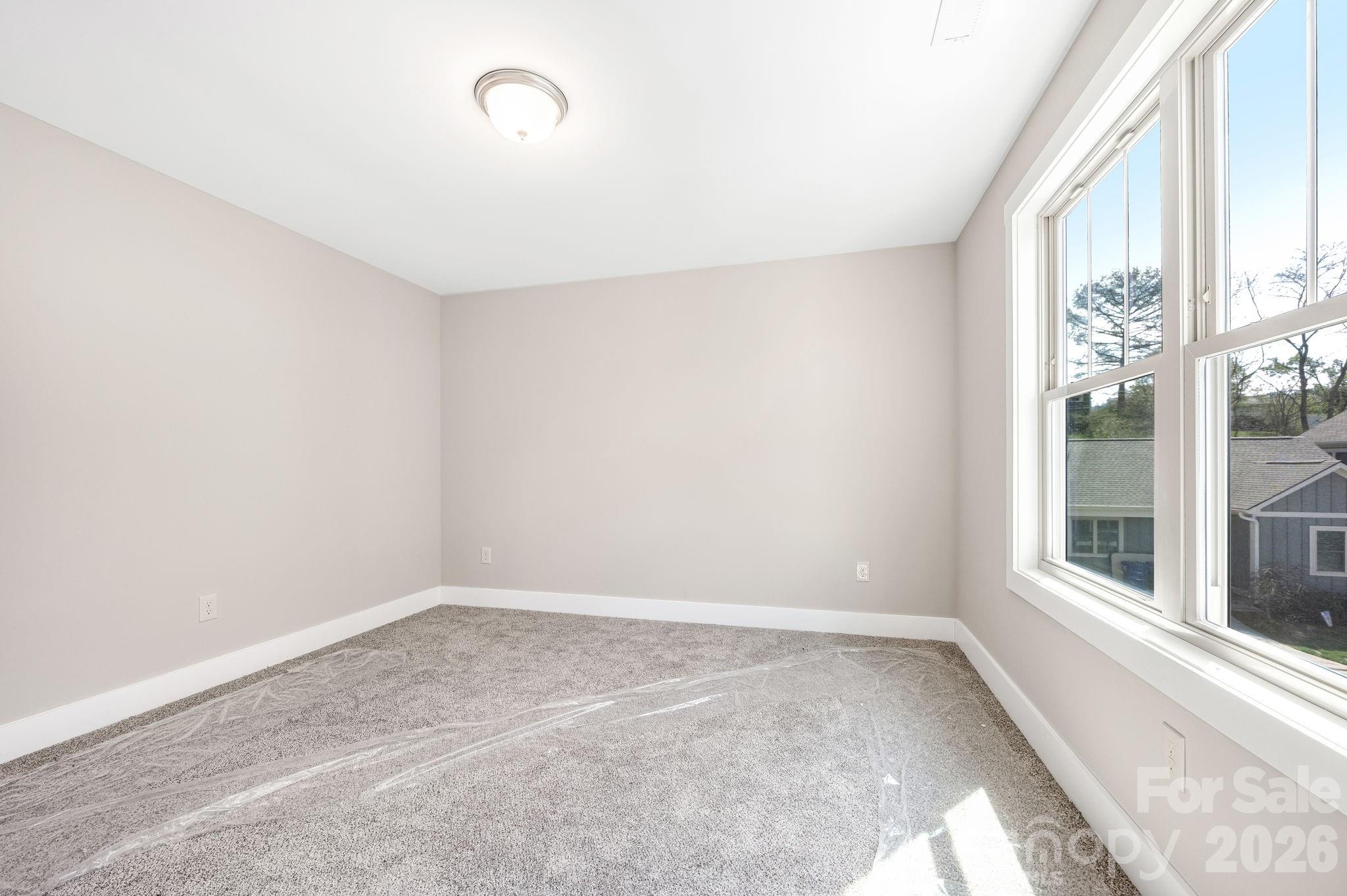 79 Wheeler Road Weaverville, NC 28787 - Photo 25 of 33 an empty room with windows