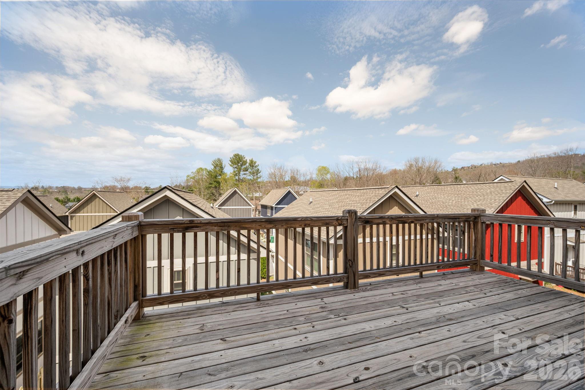 79 Wheeler Road Weaverville, NC 28787 - Photo 28 of 33 a view of a wooden deck and city view