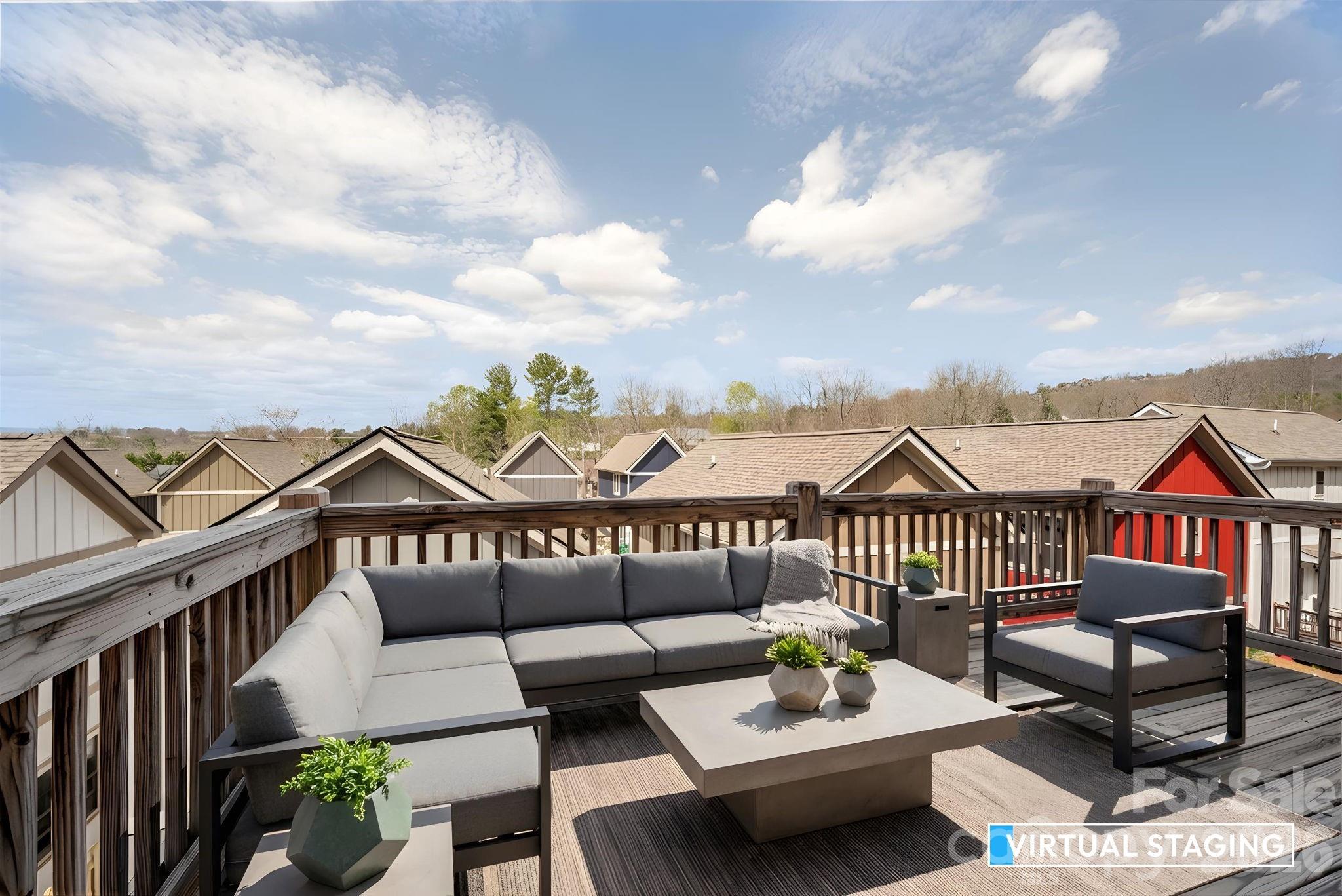 79 Wheeler Road Weaverville, NC 28787 - Photo 29 of 33 a roof deck with couches and potted plants
