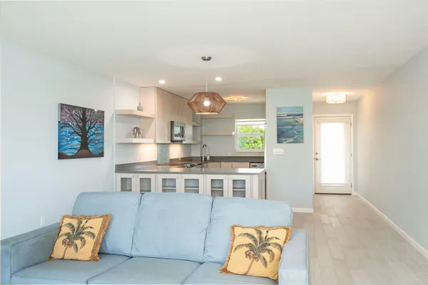 a kitchen with a refrigerator and a sink