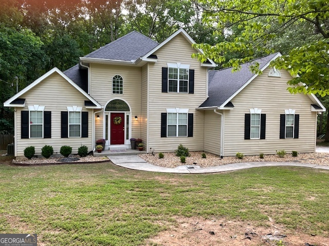 a front view of a house with garden