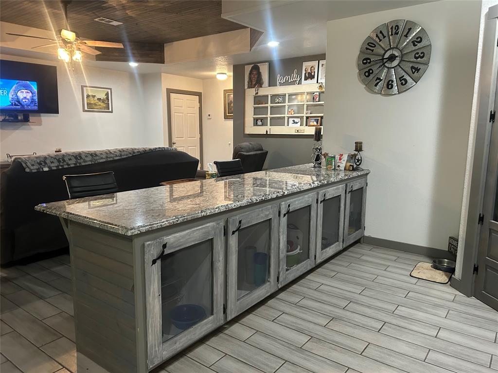 190 Private Road Groesbeck, TX 76642 - Photo 4 of 25 a kitchen with a stove and a wooden floor
