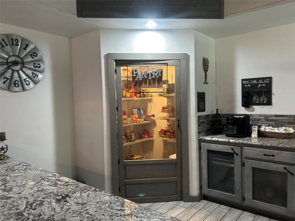 190 Private Road Groesbeck, TX 76642 - Photo 6 of 25 a kitchen with a stove and a refrigerator