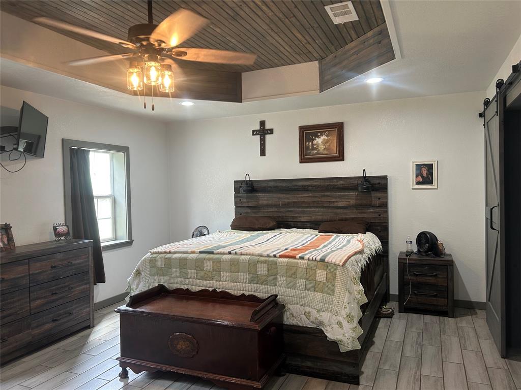 190 Private Road Groesbeck, TX 76642 - Photo 10 of 25 a bedroom with a bed and a dresser
