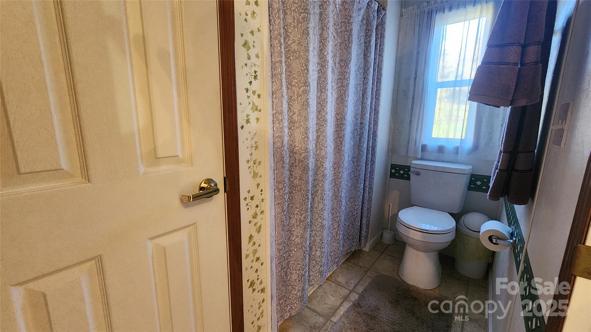 141 Hungry Creek Road Canton, NC 28716 - Photo 19 of 38 a bathroom with a toilet and a shower