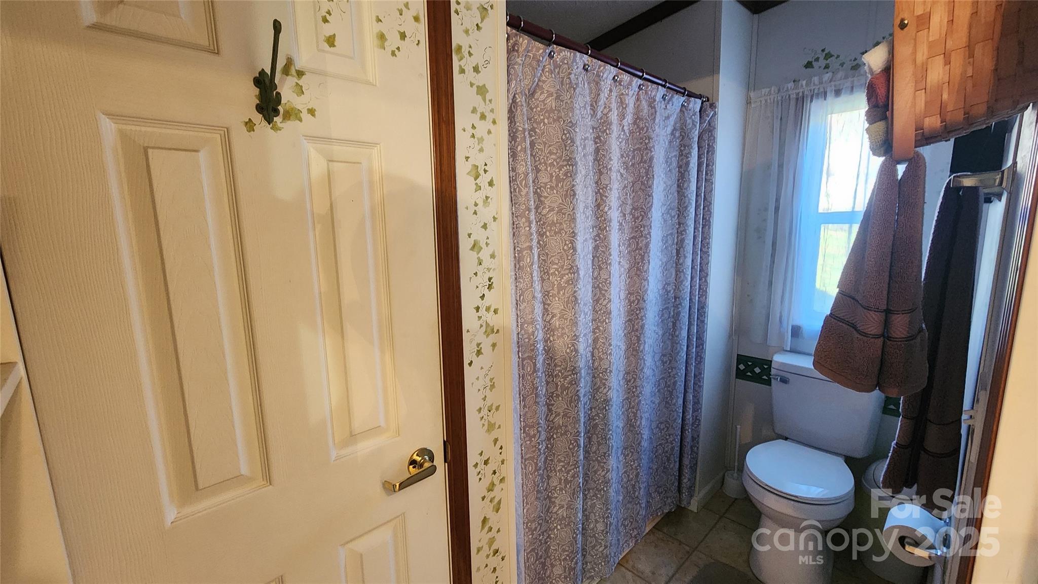 141 Hungry Creek Road Canton, NC 28716 - Photo 20 of 38 a bathroom with a sink toilet and shower